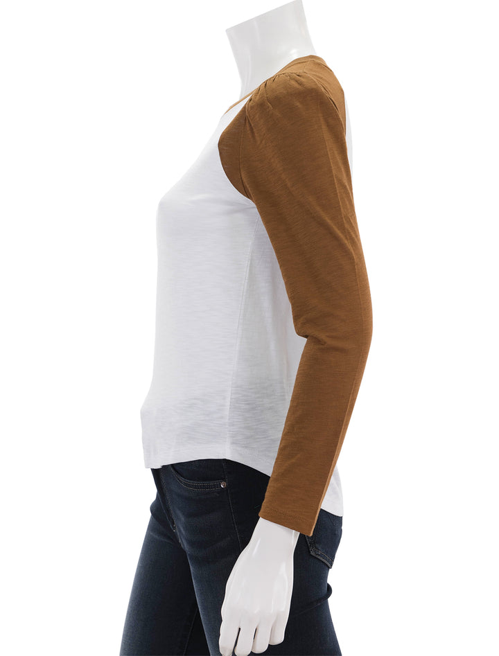 Side view of Veronica Beard's mason baseball tee in white and ochre.