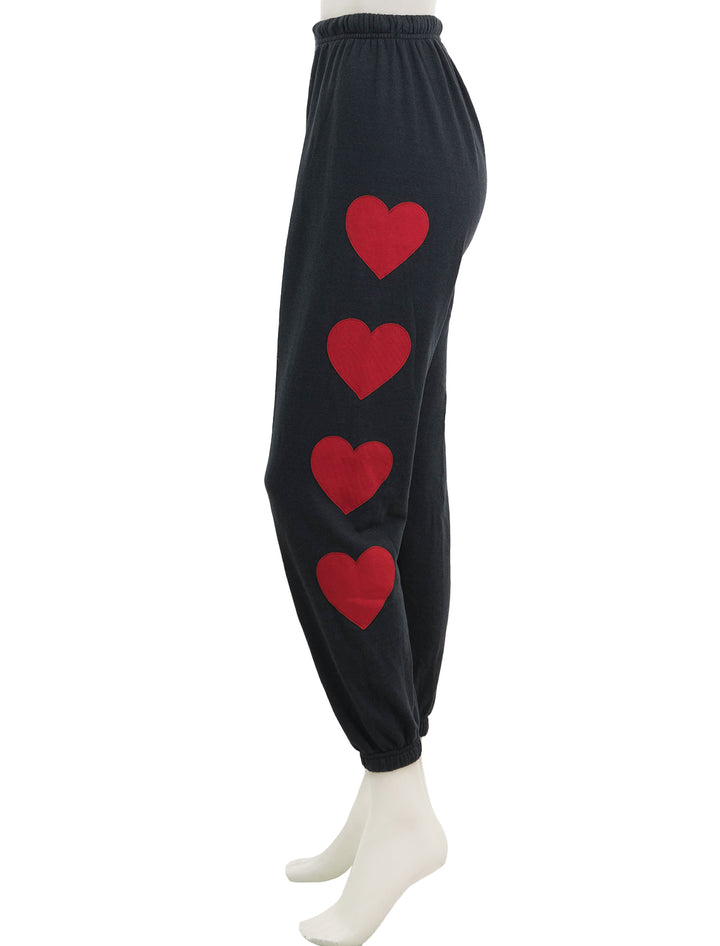 Side view of Aviator Nation's heart stitch 4 sweatpants in charcoal.