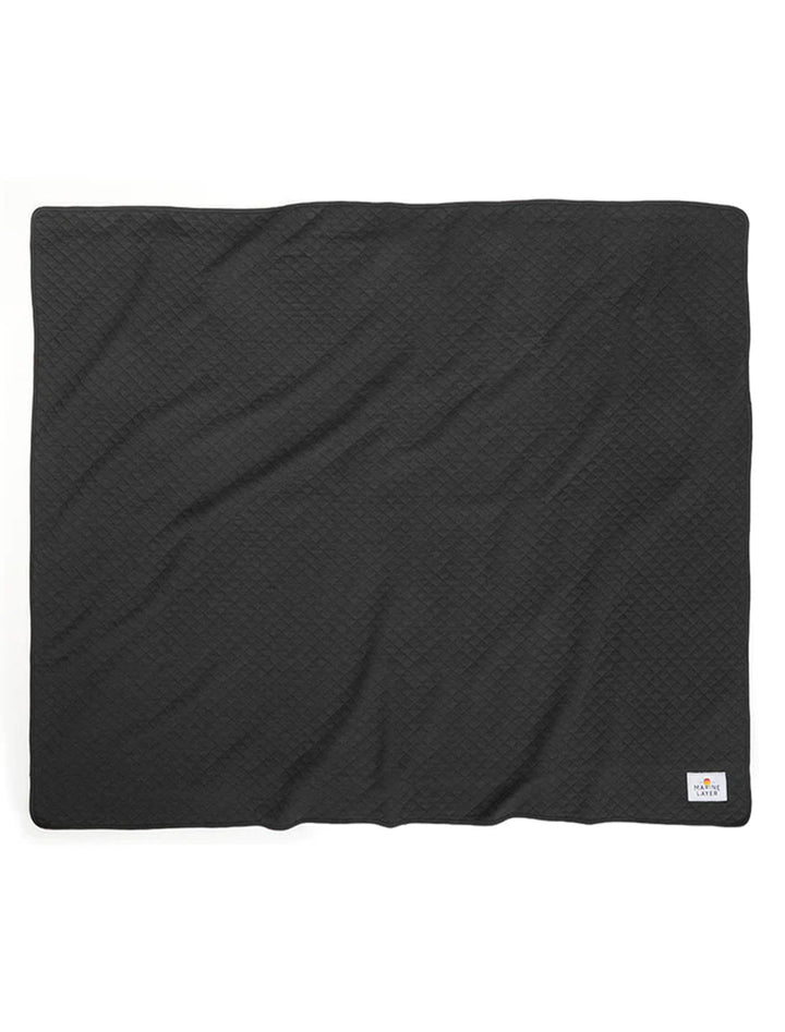 Full view of Marine Layer's corbet blanket in charcoal