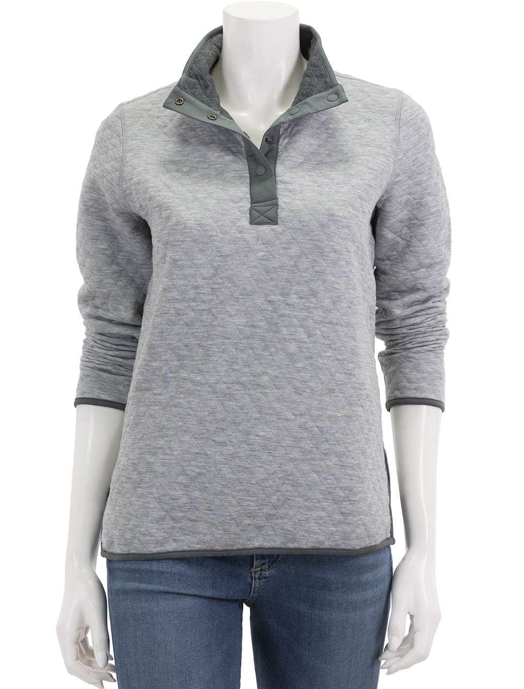 Model wearing Marine Layer's reversible corbet pullover in charcoal and heather grey.