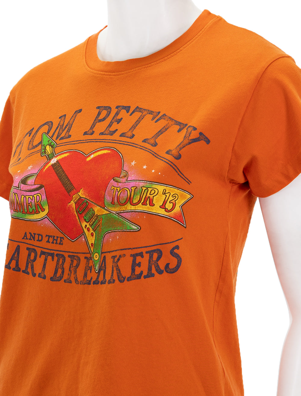 Close-up view of Daydreamer's tom petty t-shirt in tangerine.
