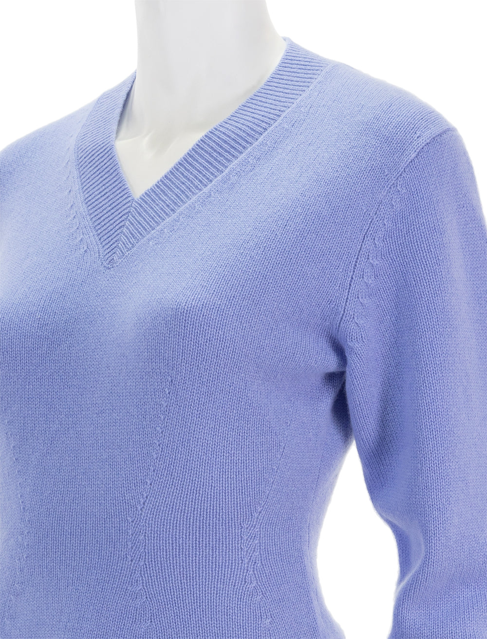 Close-up view of Theory's peplum vneck cashmere pullover in grotto.