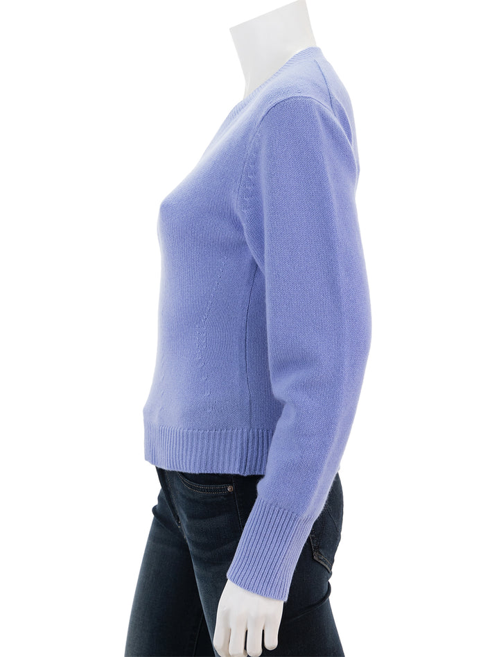 Side view of Theory's peplum vneck cashmere pullover in grotto.