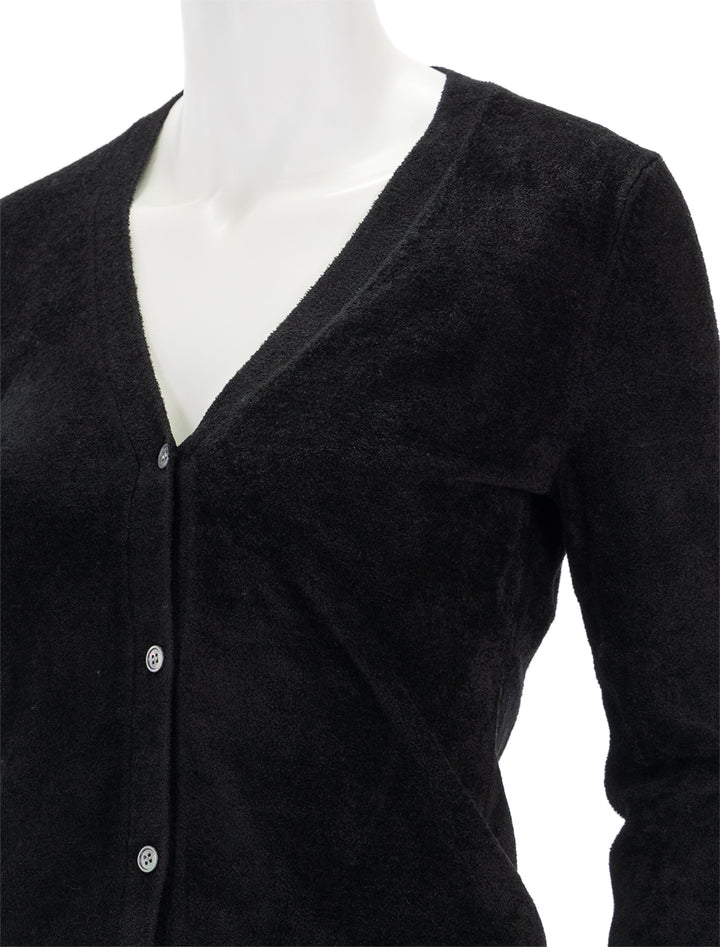 Close-up view of Theory's velvet cardi in black.