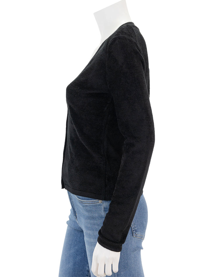 Side view of Theory's velvet cardi in black.
