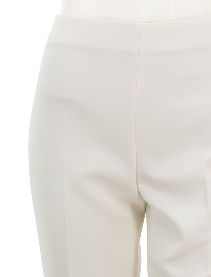 Close-up view of Theory's tailored kick pant in ivory.