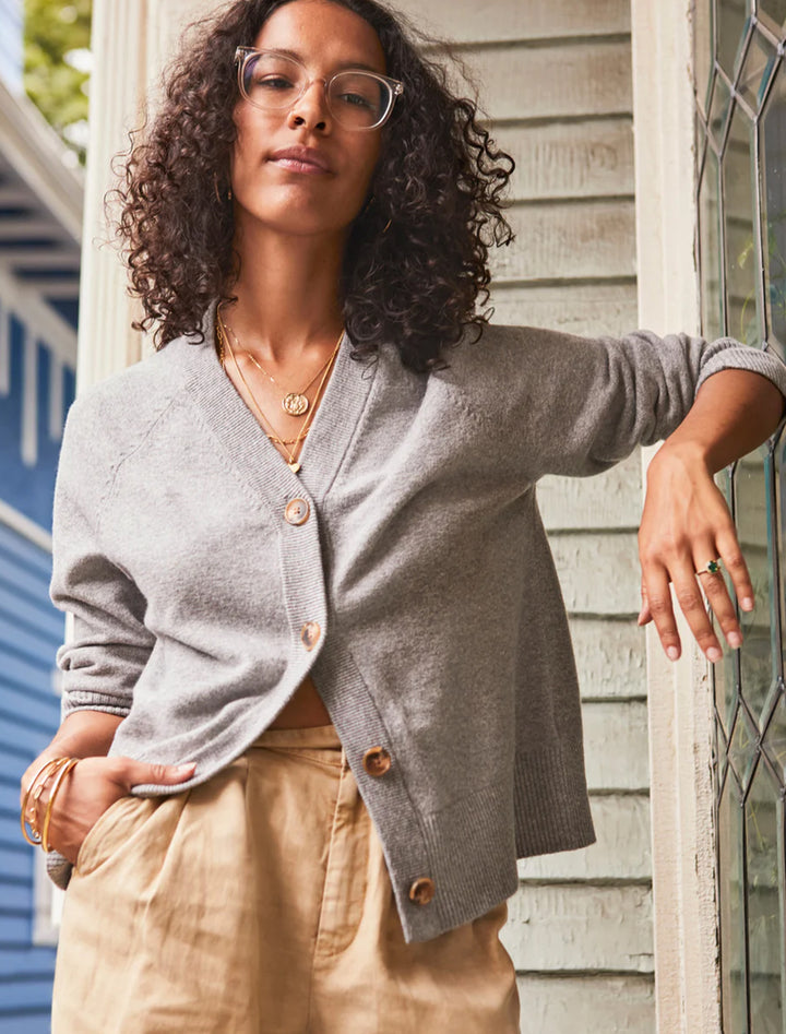 Model wearing Faherty's jackson cardigan in grey heather.