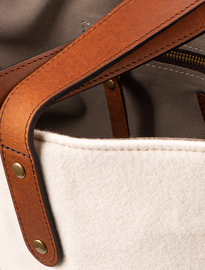 Close-up view of Heritage Gear's packers cream "titletown" tote bag.