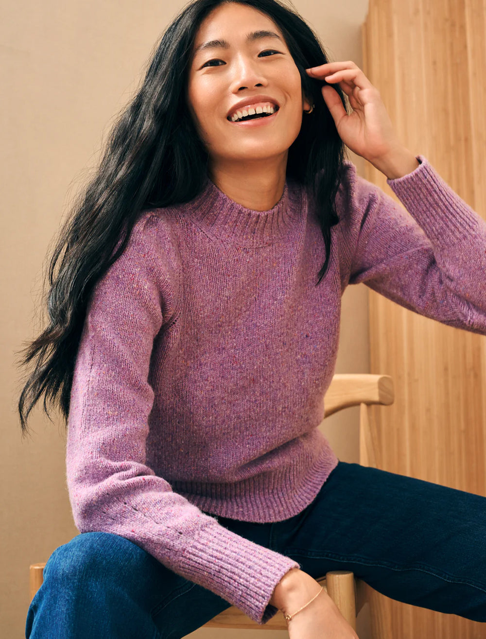 Model wearing Faherty's boone sweater in lavender frost.