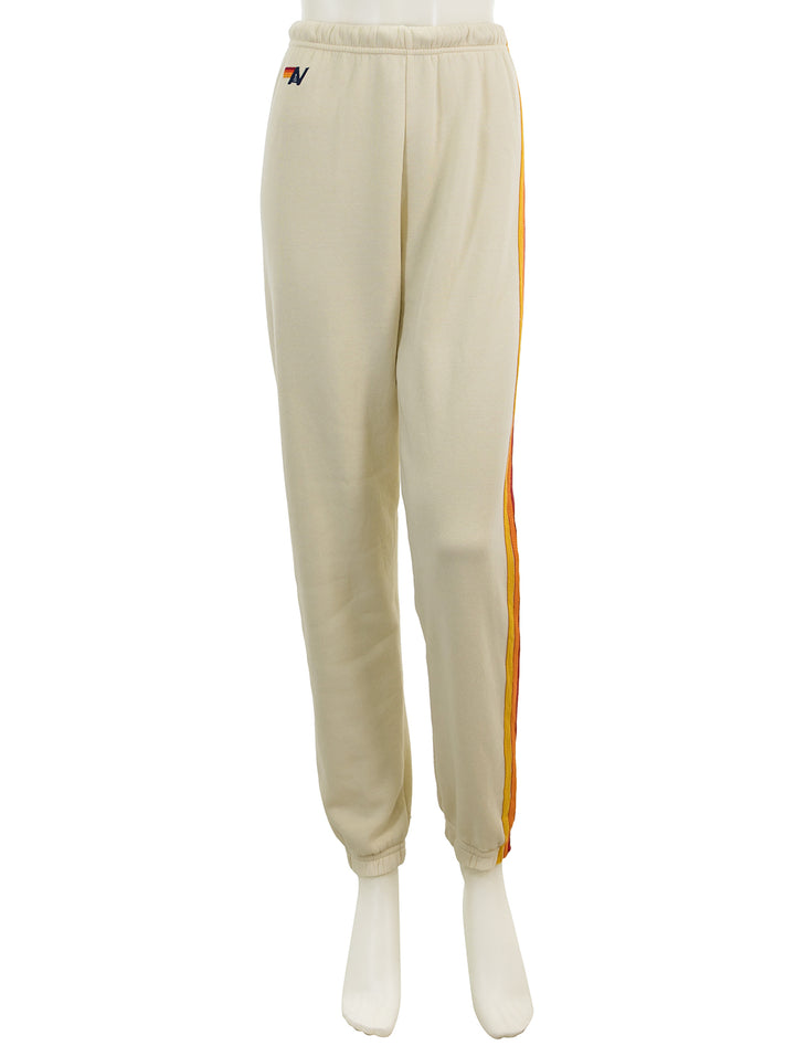 Front view of Aviator Nation's 5 stripe womens sweatpants in vintage white.