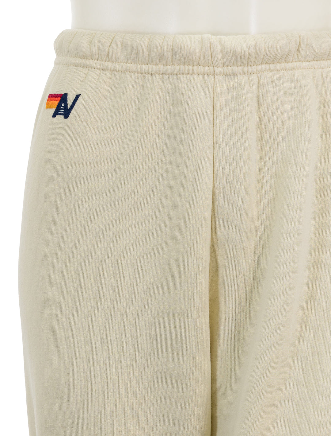 Close-up view of Aviator Nation's 5 stripe womens sweatpants in vintage white.