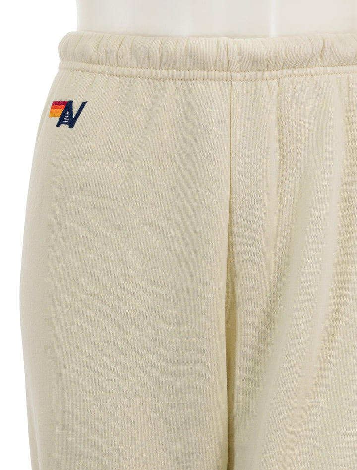 Close-up view of Aviator Nation's 5 stripe womens sweatpants in vintage white.