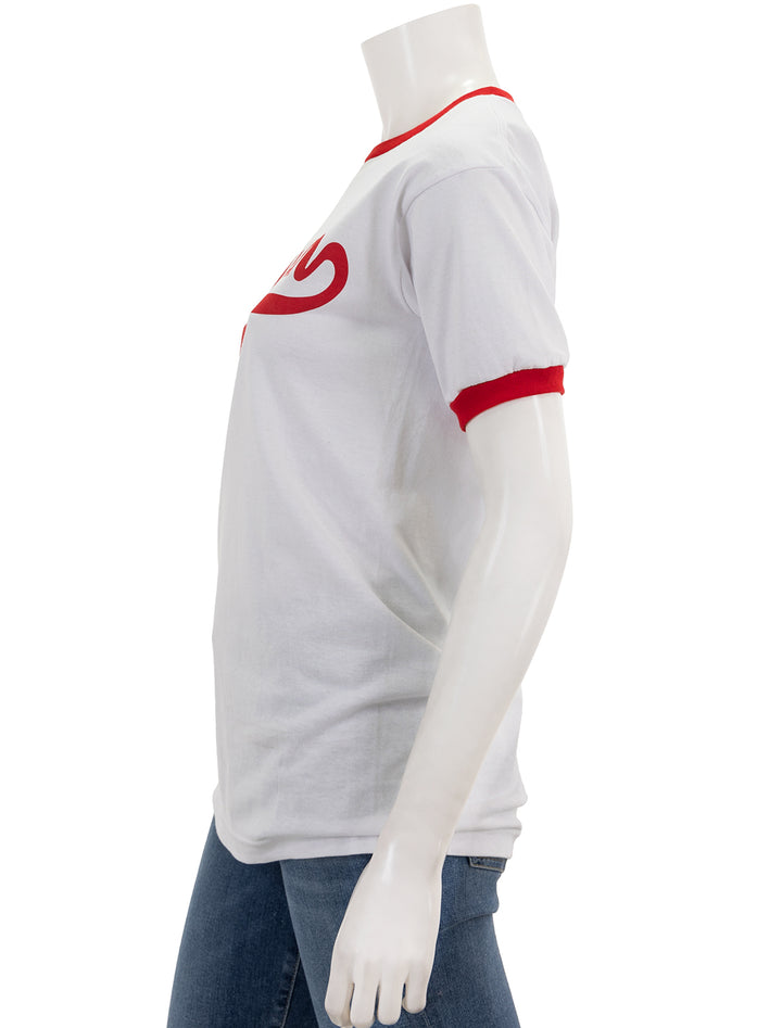 Side view of Recess Apparel's script ringer tee in white and red.