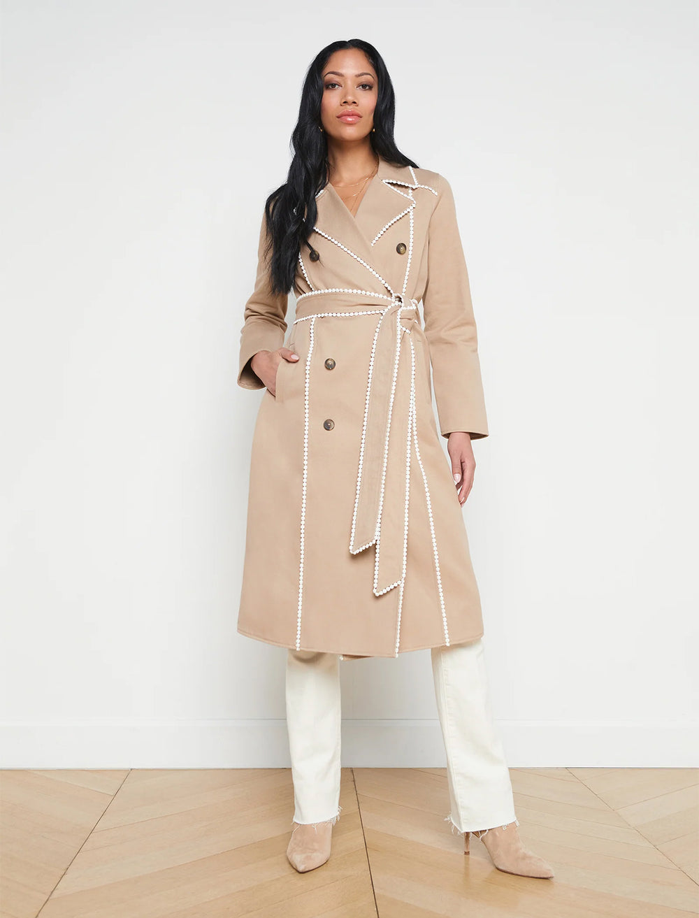 model wearing venus trench with trim in almond