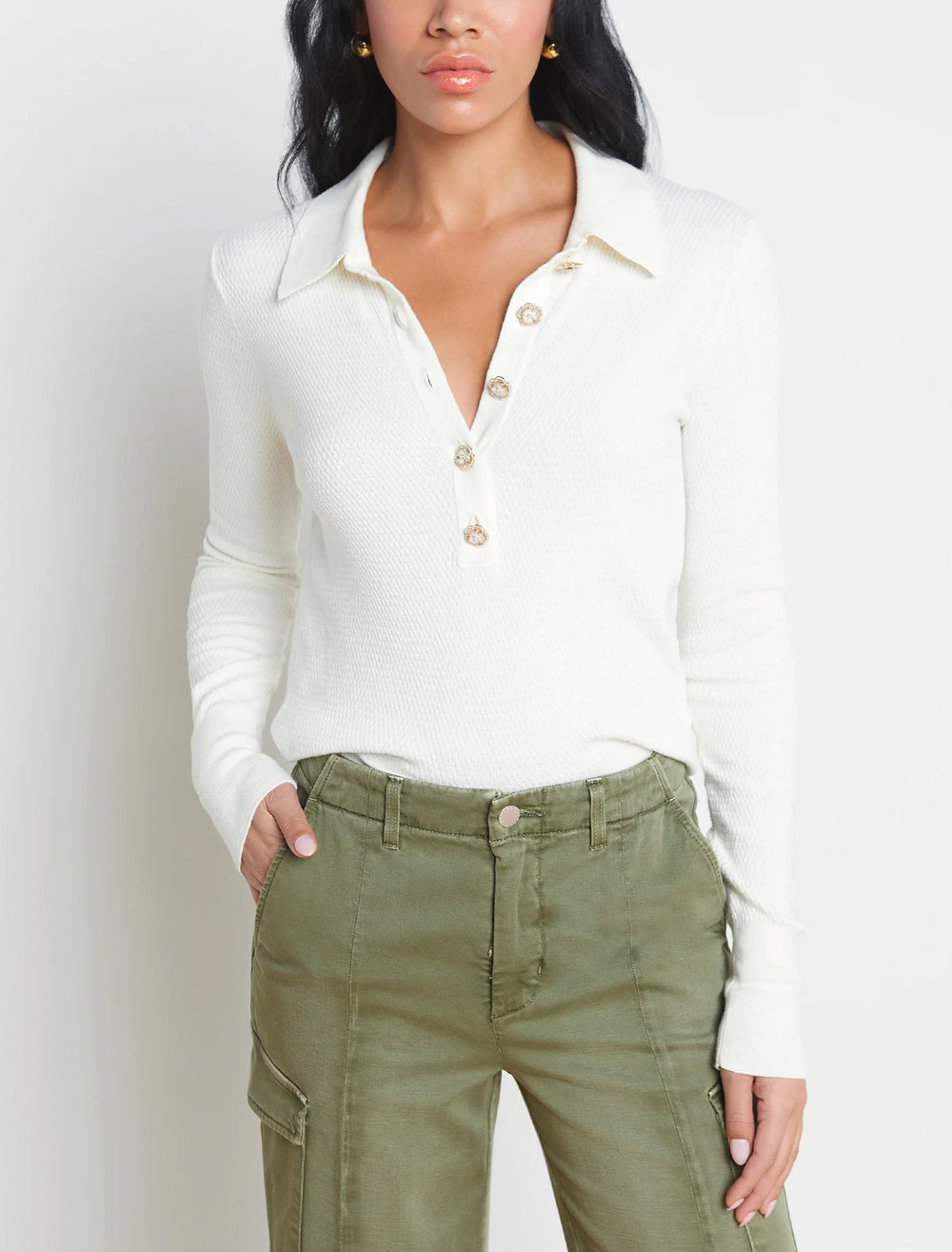 Model wearing L'agence sterling jewel button sweater in ivory.