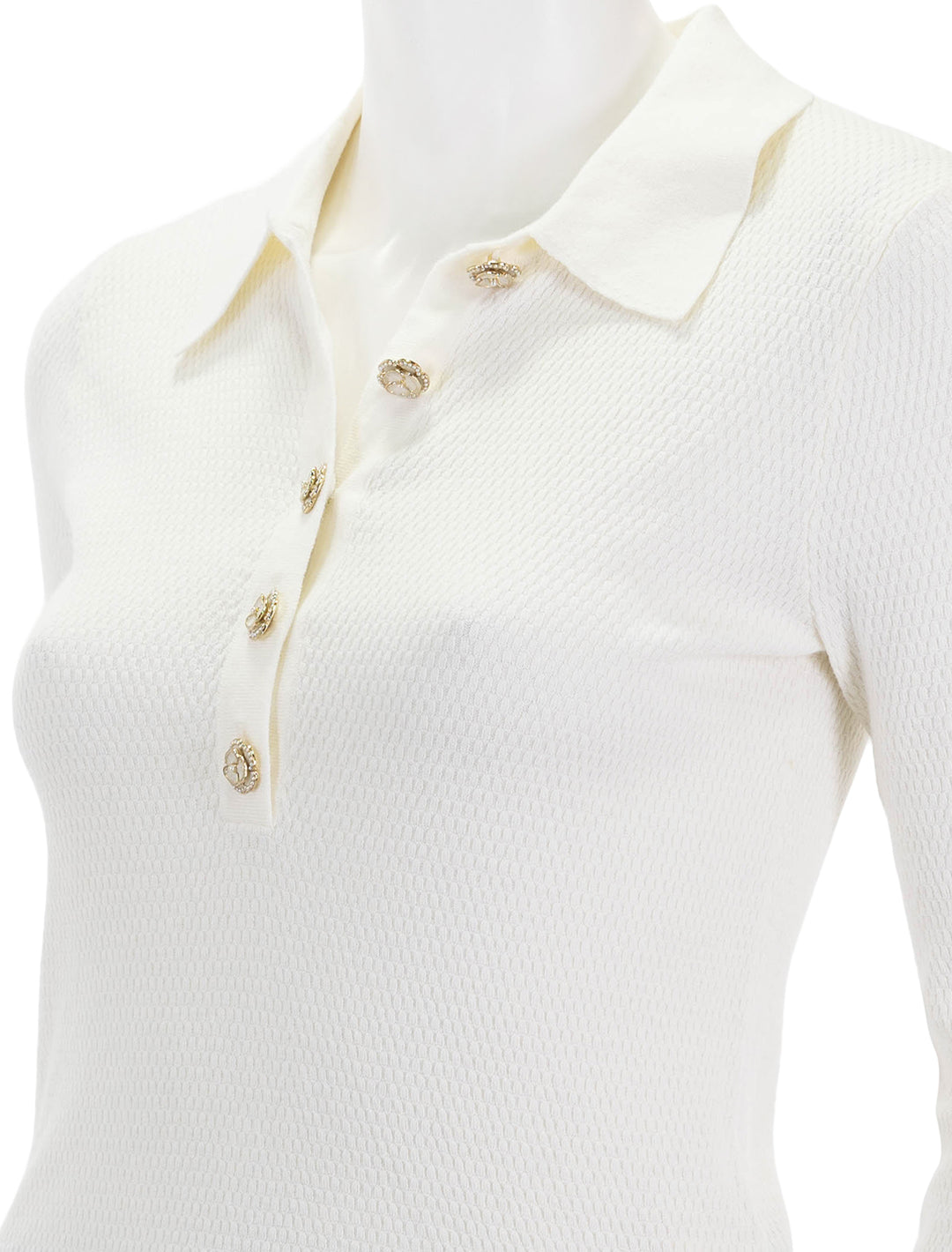 Close-up view of L'agence sterling jewel button sweater in ivory.