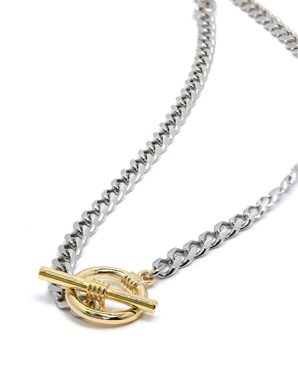 Stylized laydown of AV Max's Two Tone Curb Chain with Toggle Necklace.
