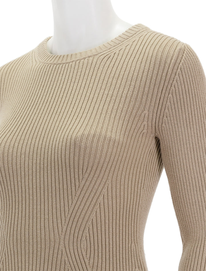 Close-up view of Nation LTD's lara ribbed sweater in paper bag.