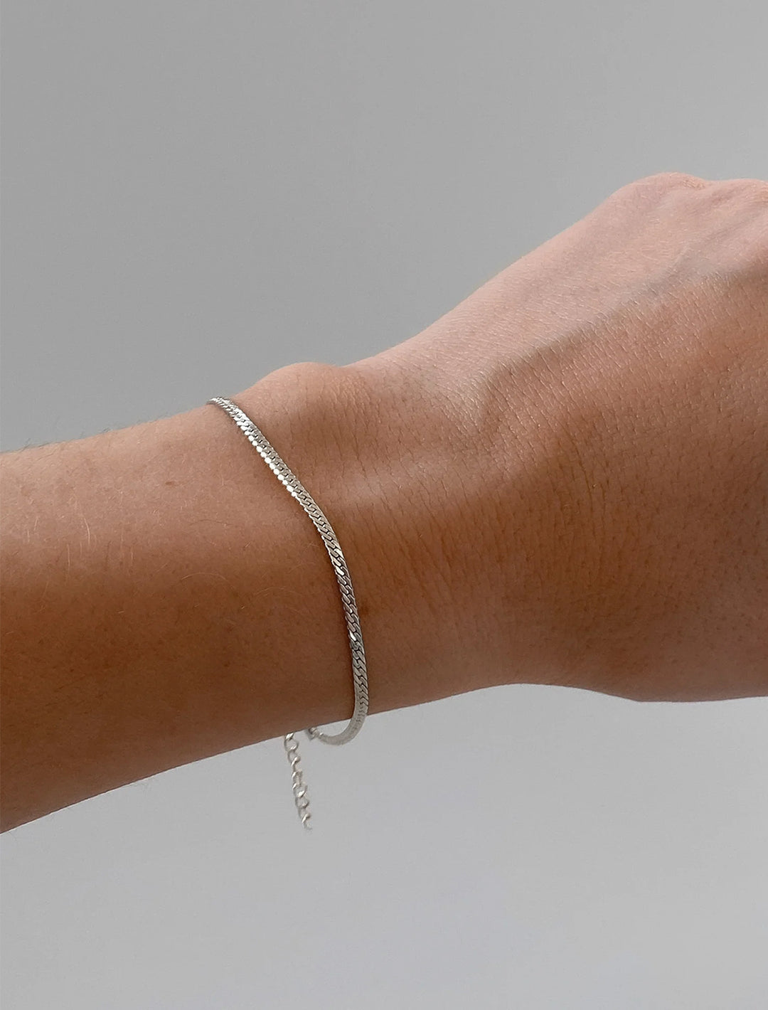 model wearing mini dani herringbone bracelet in silver