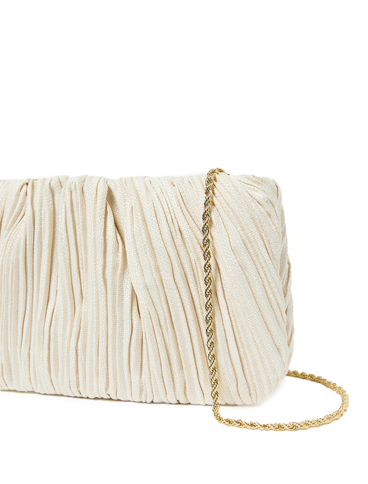 Close-up view of Loeffler Randall's brit pleated flat clutch in cream.