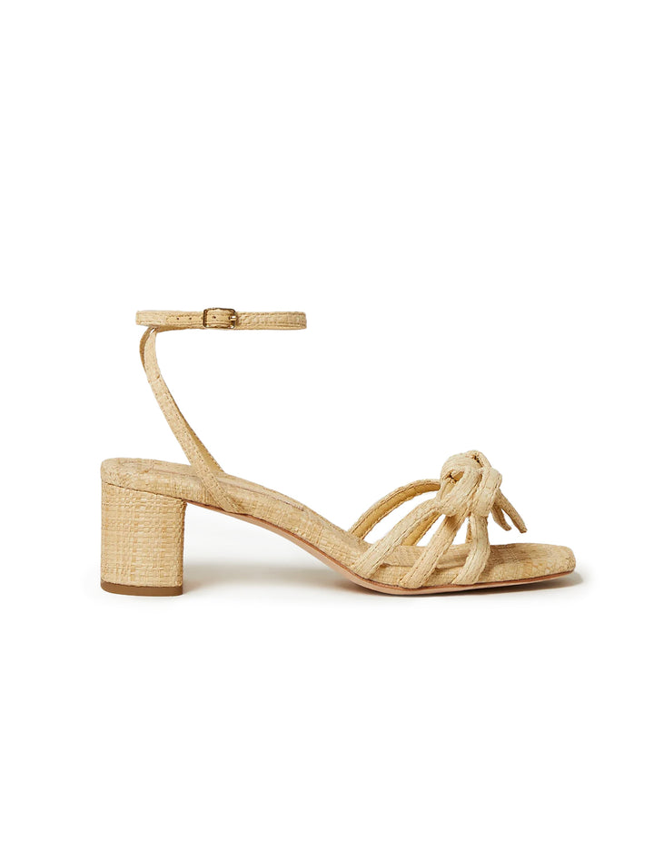 Side view of Loeffler Randall's mikel mid heel bow sandal in natural.