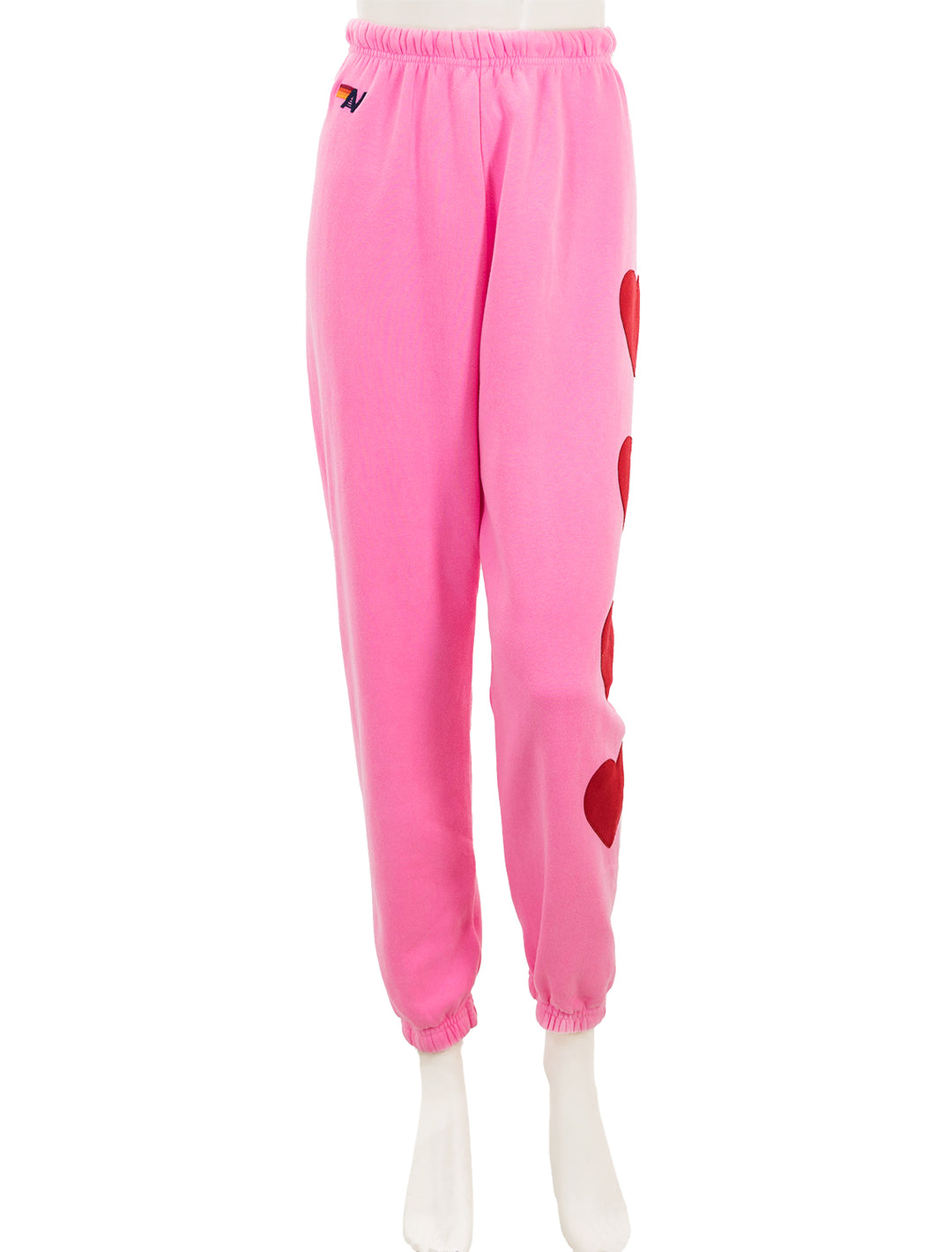 Front view of Aviator Nation's heart stitch four sweatpants in pink.
