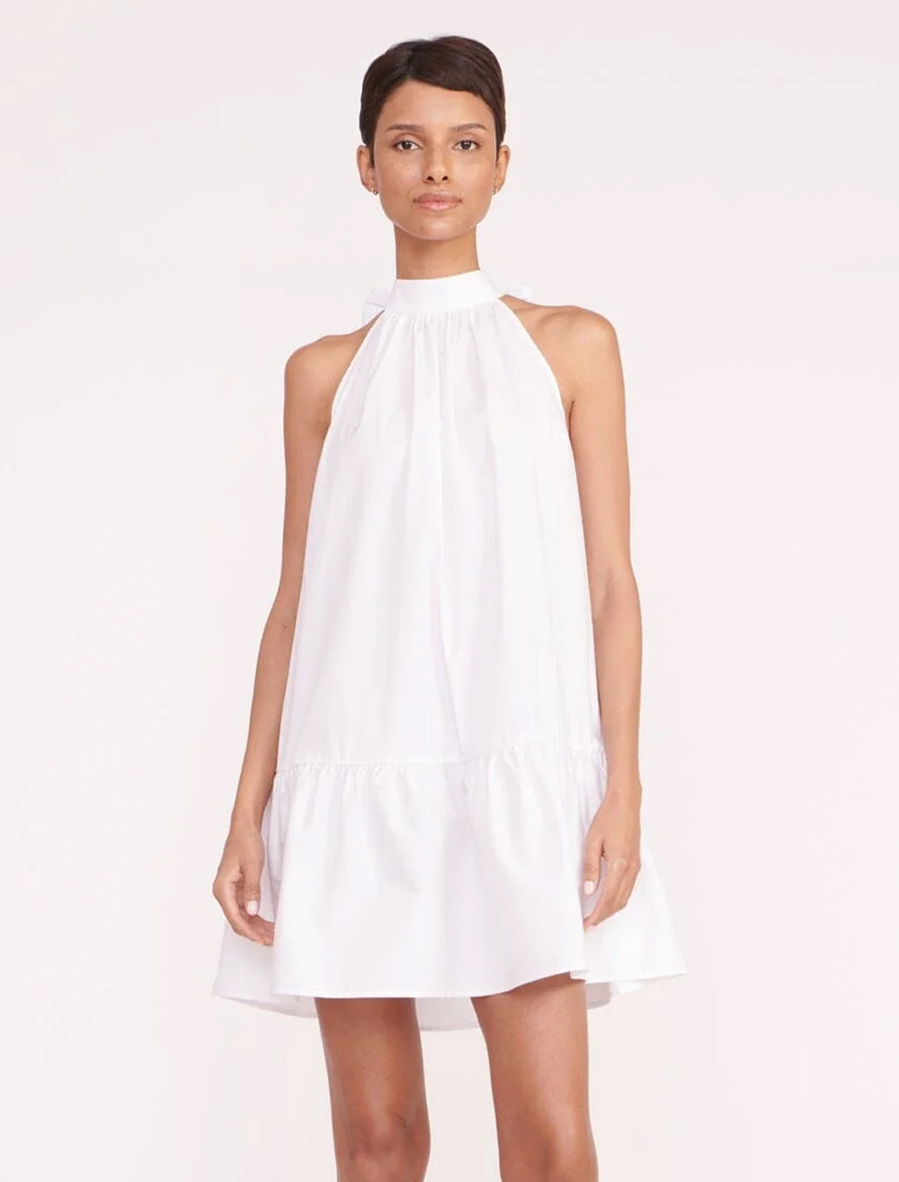 Model wearing STAUD's marlowe dress in white.