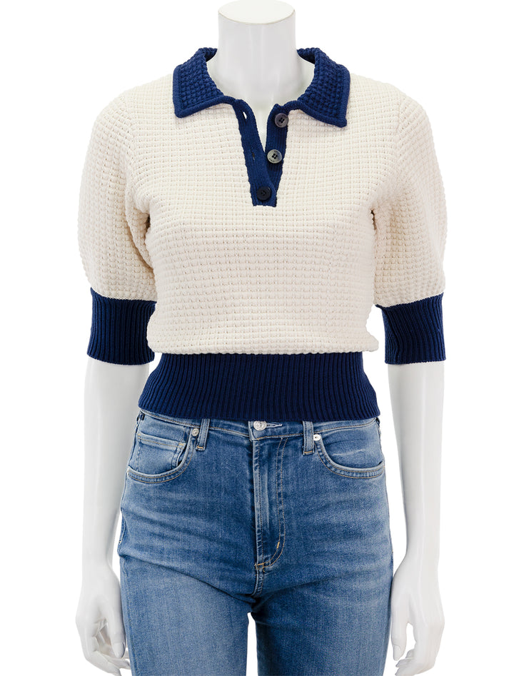 Front view of Staud's altea sweater in ivory and navy.