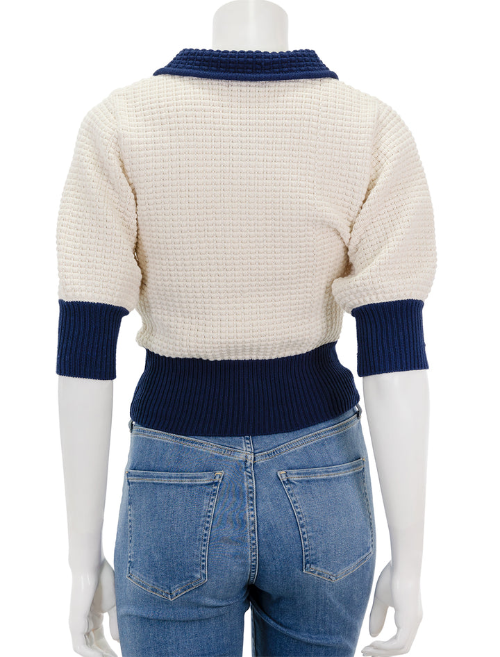 Back view of Staud's altea sweater in ivory and navy.