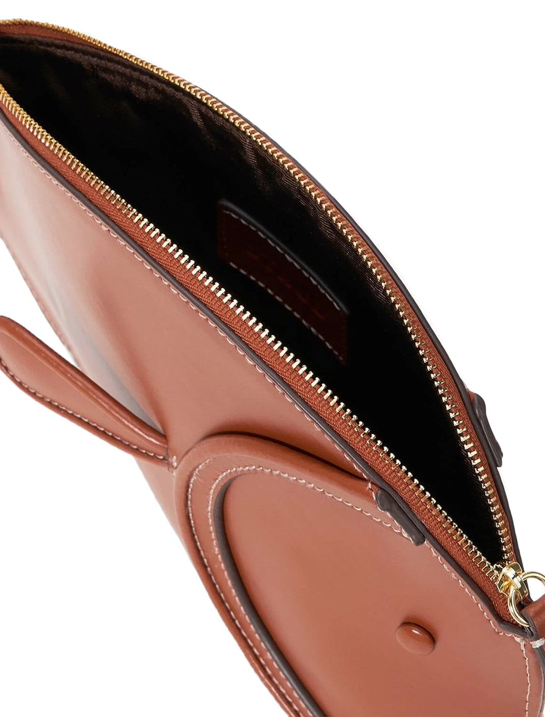 Close-up inside view of STAUD's pesce leather clutch in tan.