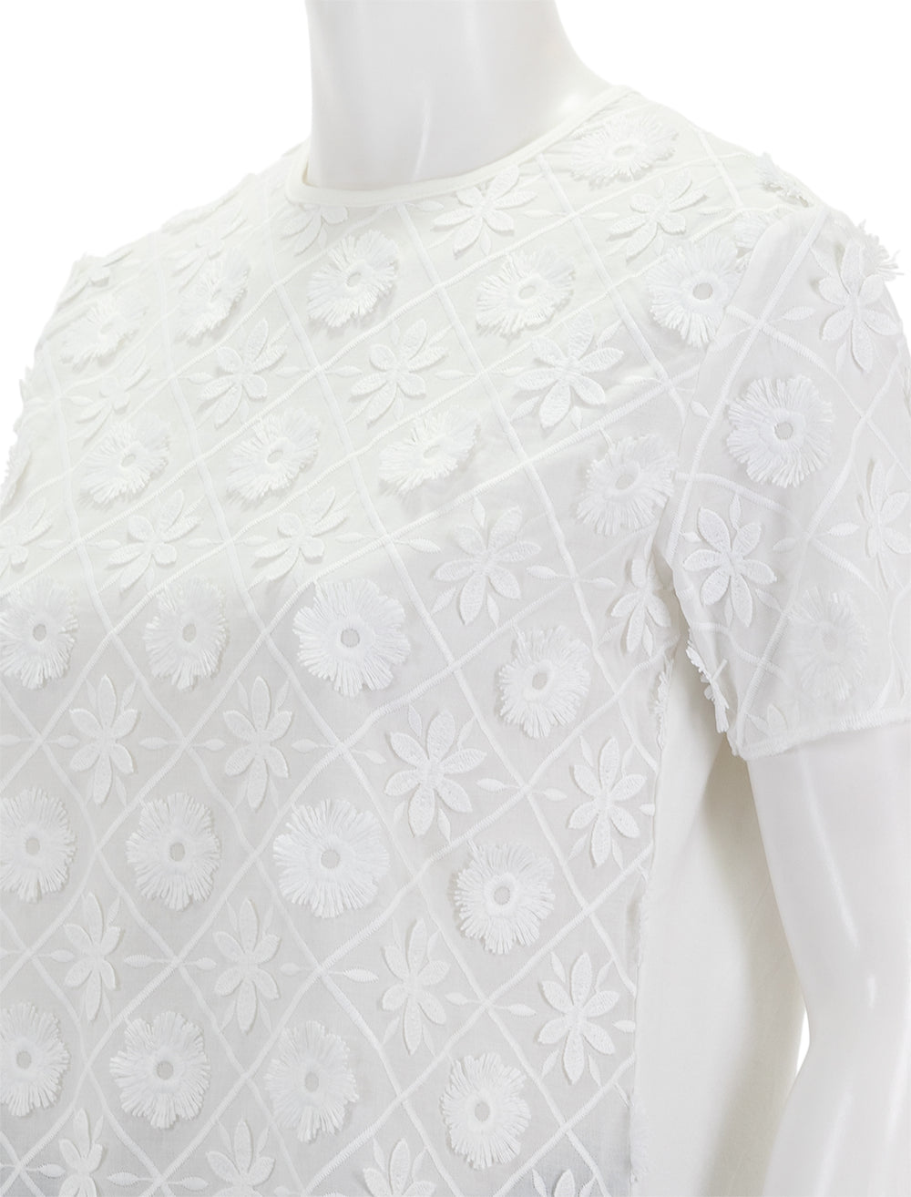 Close-up view of Vilagallo's darzie top in ivory.