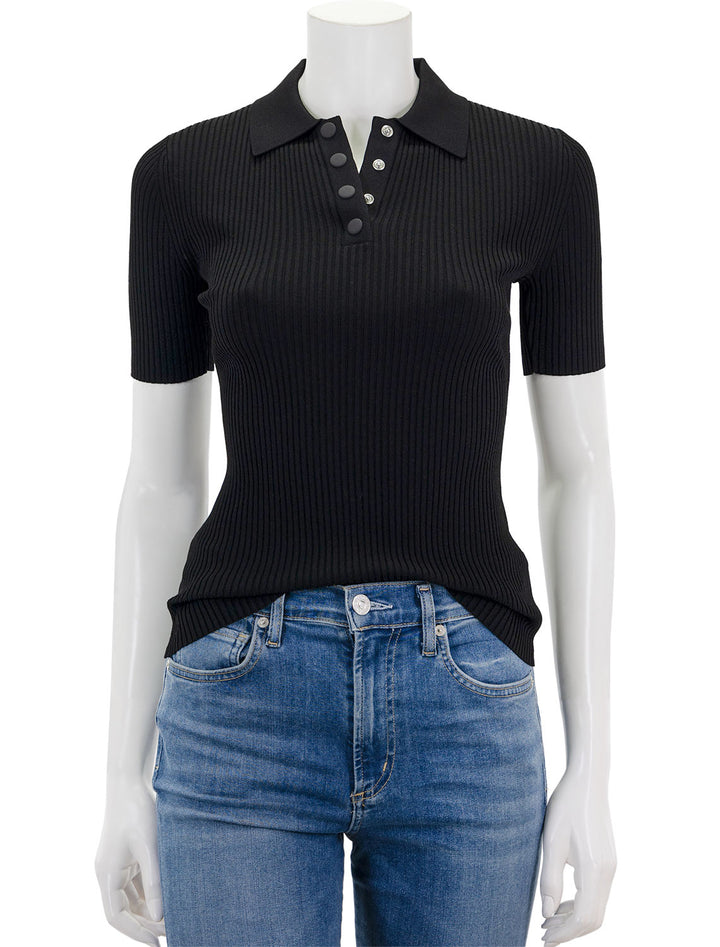 Front view of Theory's rib polo compact top in black.