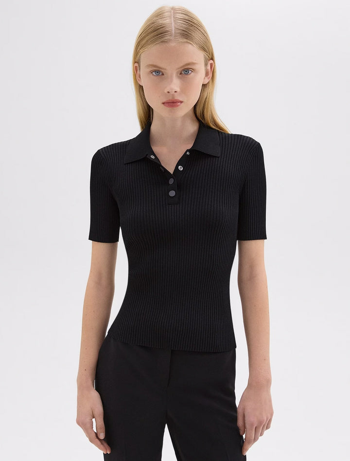 Model wearing Theory's rib polo compact top in black.