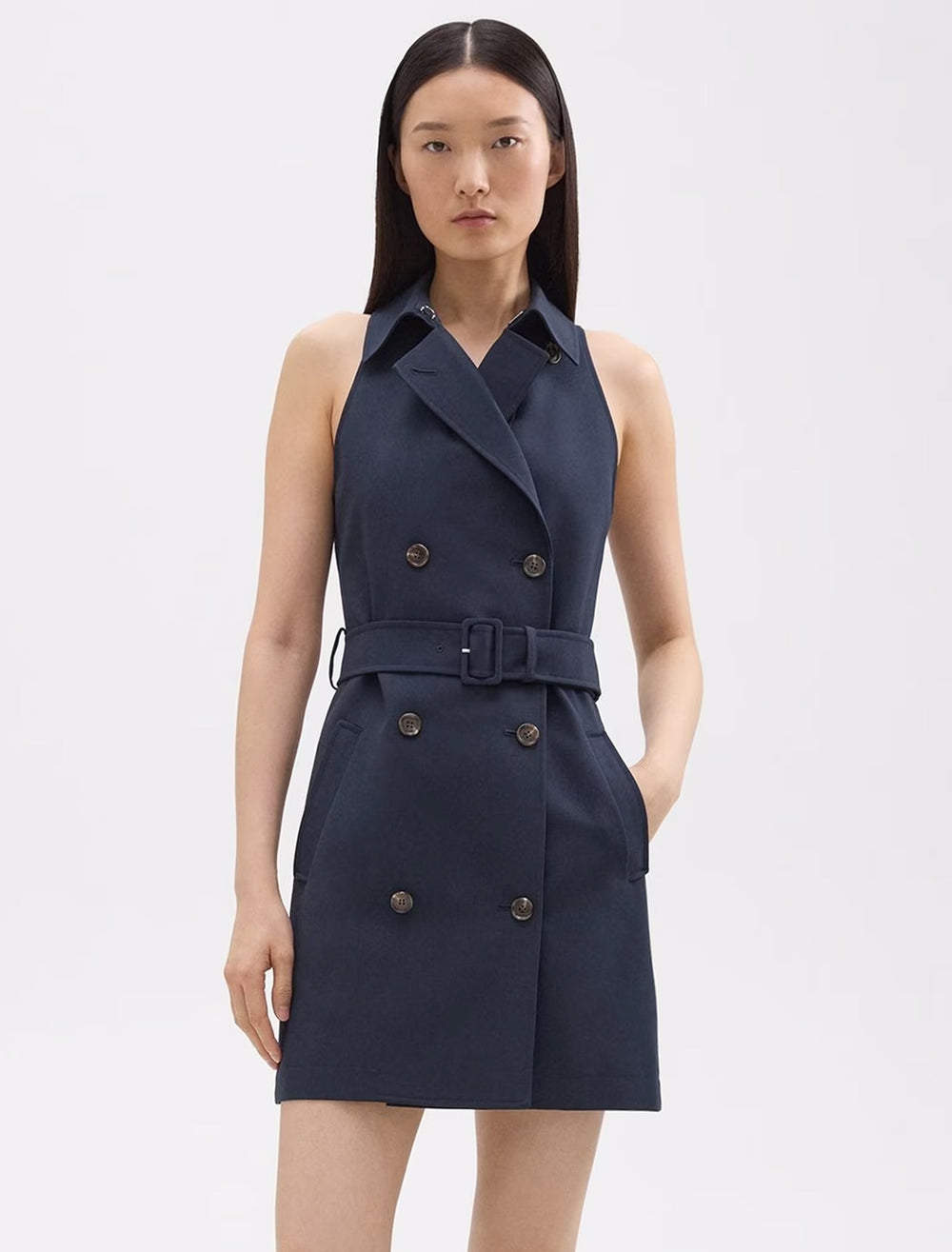 Model wearing Theory's halter trench dress in nocturne navy.