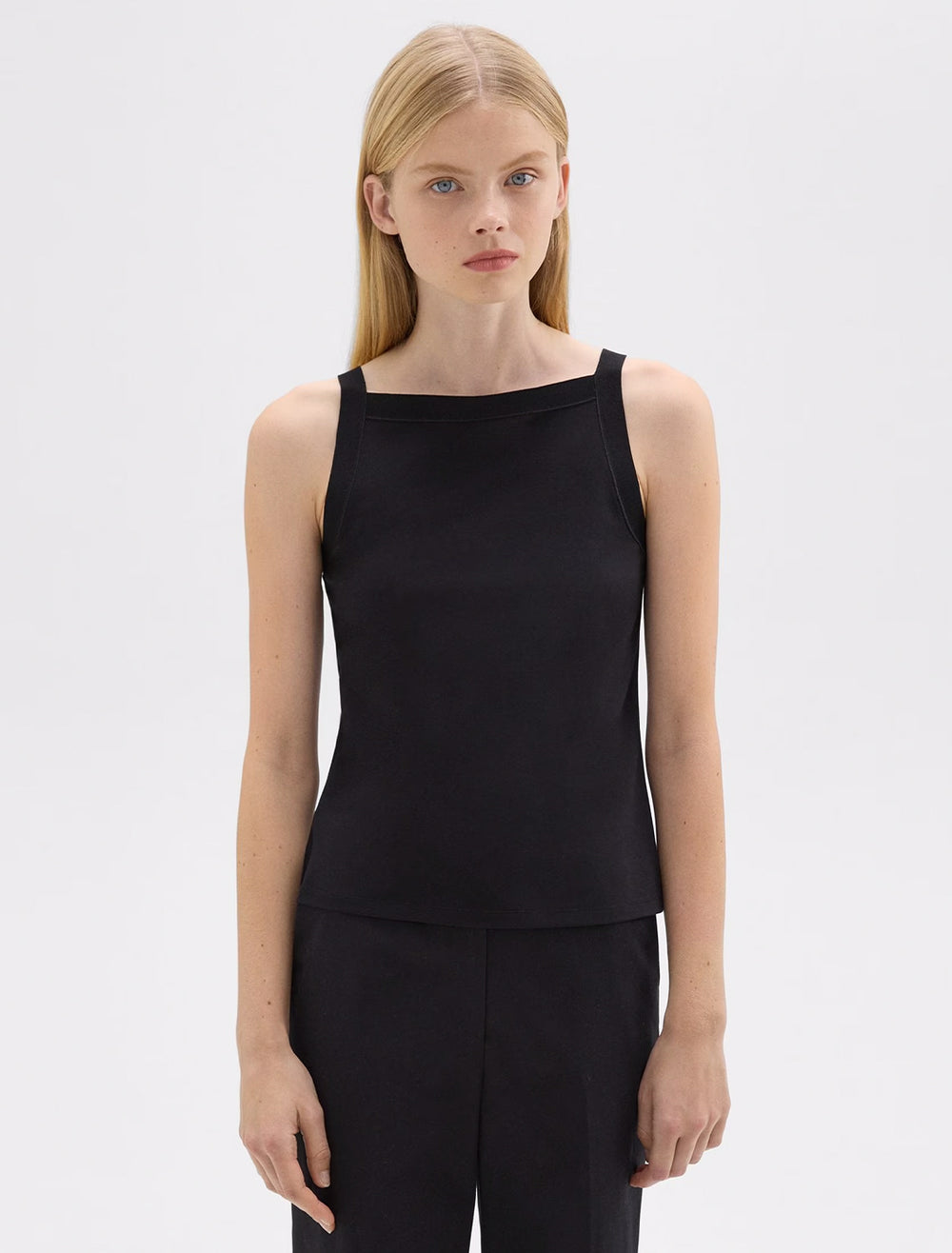 Model wearing Theory's square high neck tank in black.