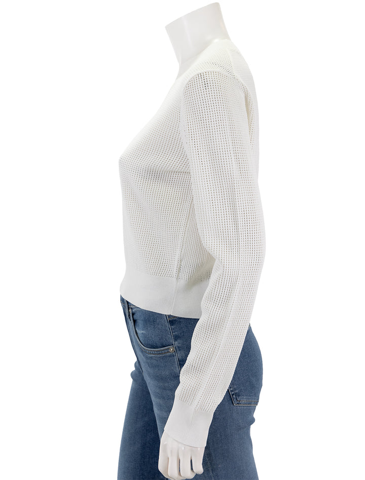 Side view of Theory's pointelle pullover in white.