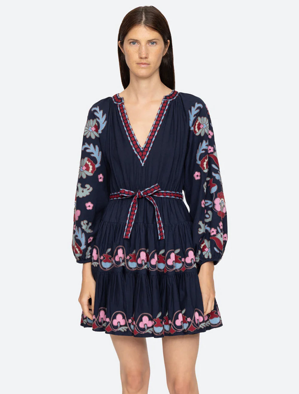 Model wearing Sea NY's eclisse embroidery tunic dress in navy.