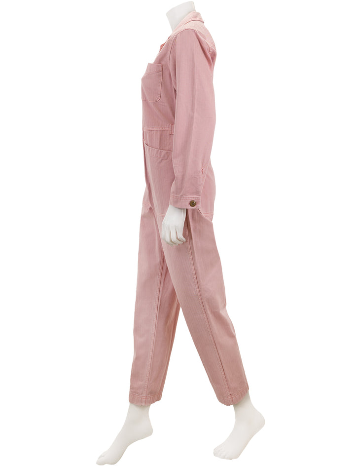 Side view of Alex Mill's standard jumpsuit in herringbone blush pink.