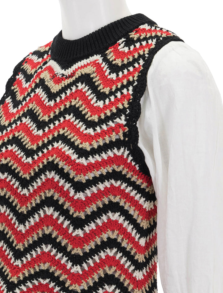 Close-up view of Ganni's cotton crochet vest in racing red.