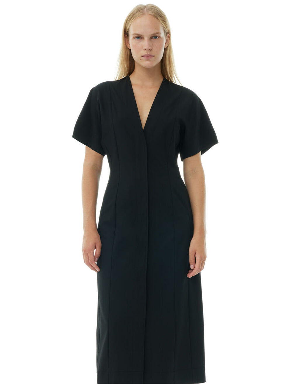 Model wearing GANNI's melange midi dress in black.