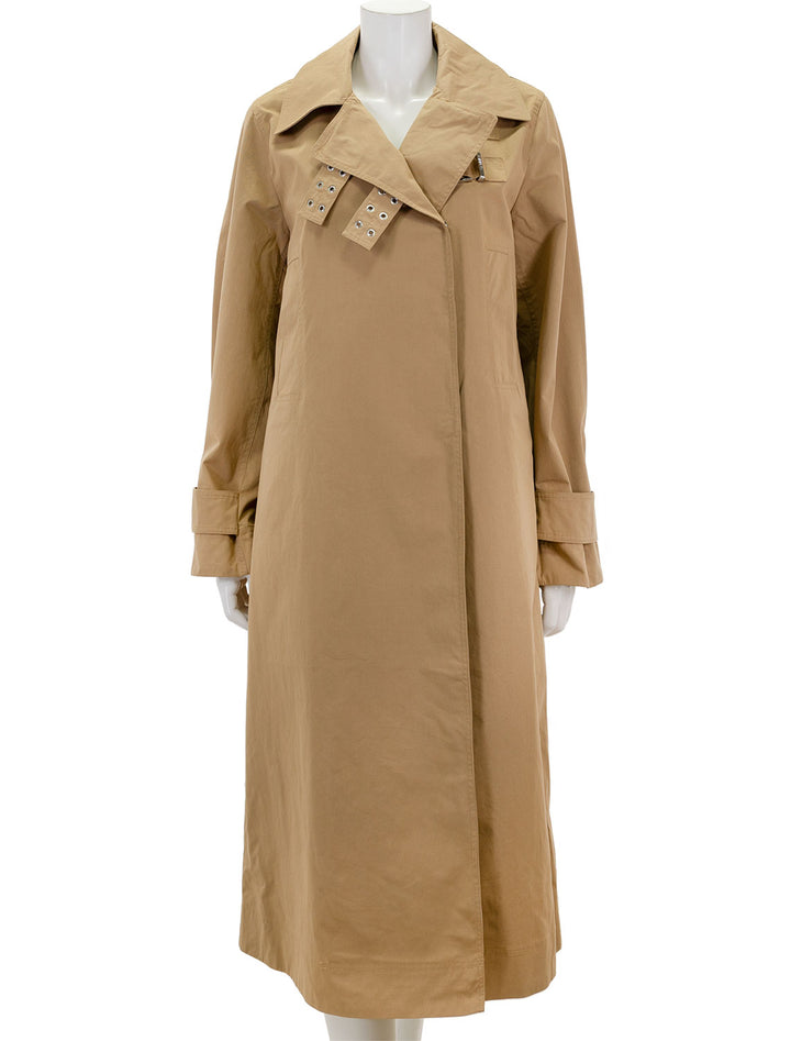 Front view of GANNI's cotton twill coat in tigers eye.