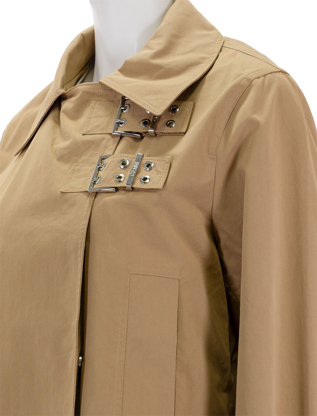 Close-up view of GANNI's cotton twill coat in tigers eye.