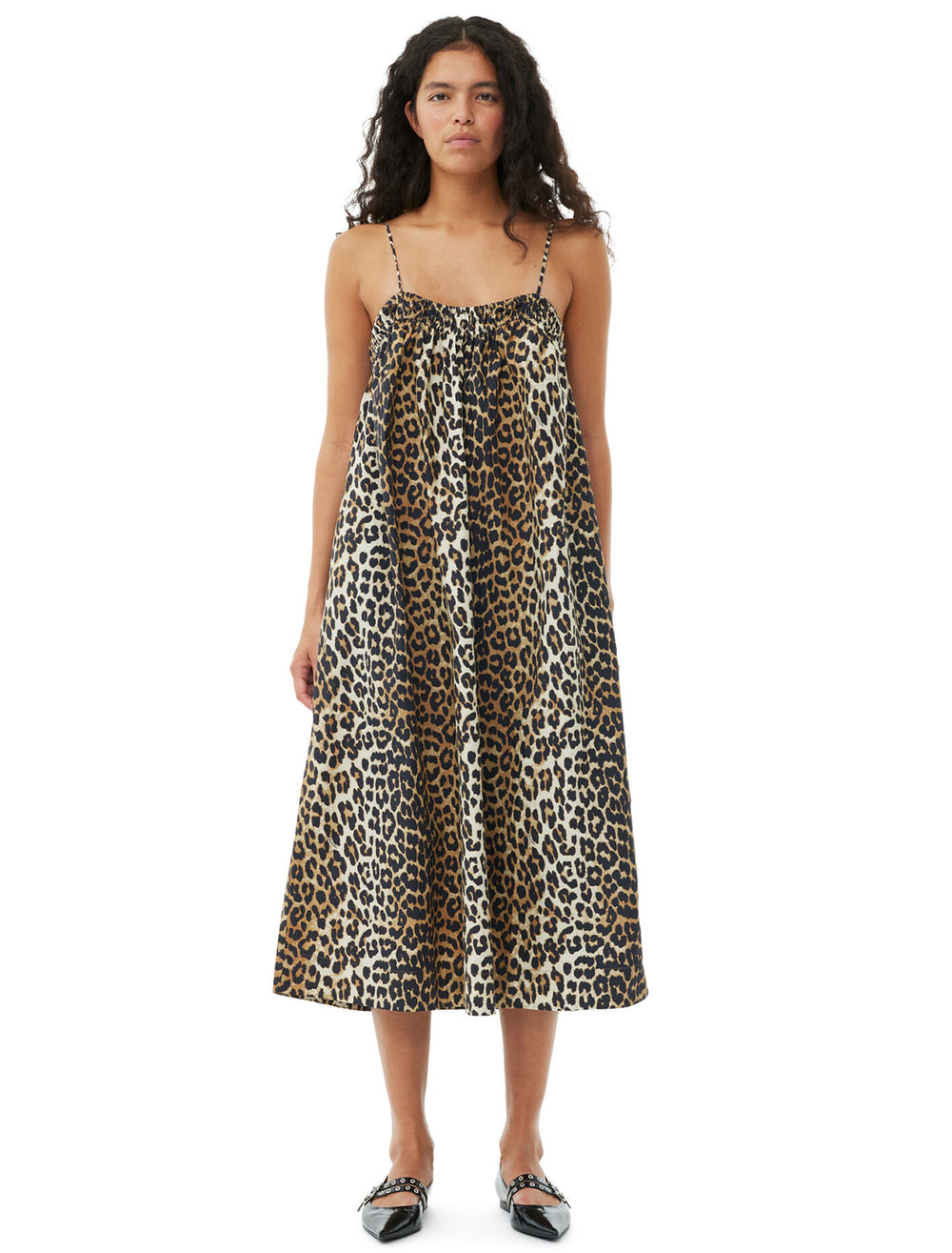 Model wearing GANNI's printed cotton midi dress in leopard.