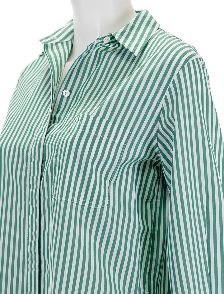 Close-up view of Alex Mill's belle shirt dress in green and white.