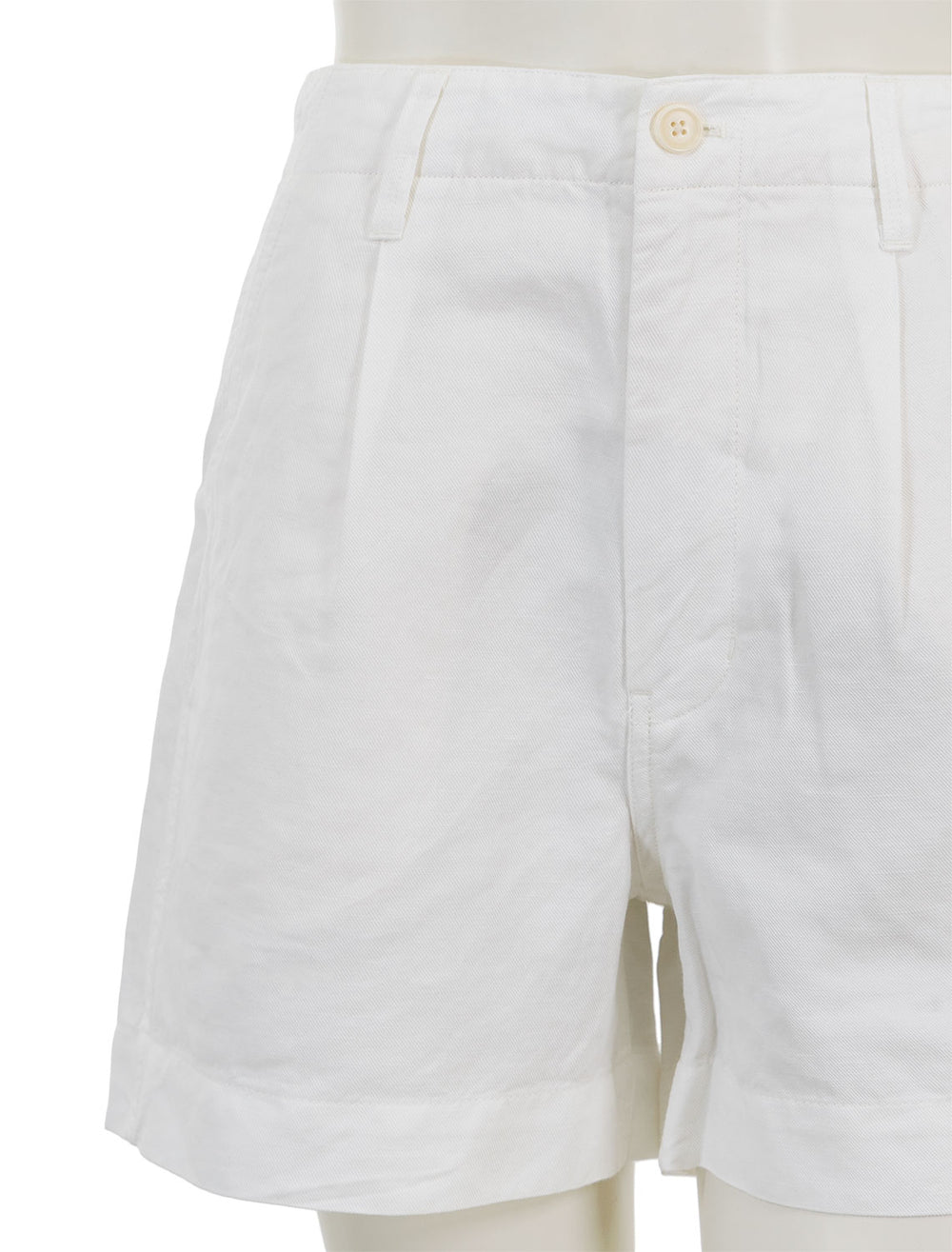 Close-up view of Alex Mill's pleated twill shorts in ecru.