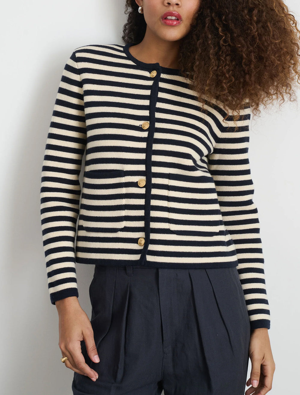 Model wearing Alex Mill's paris sweater in navy and ivory stripe.