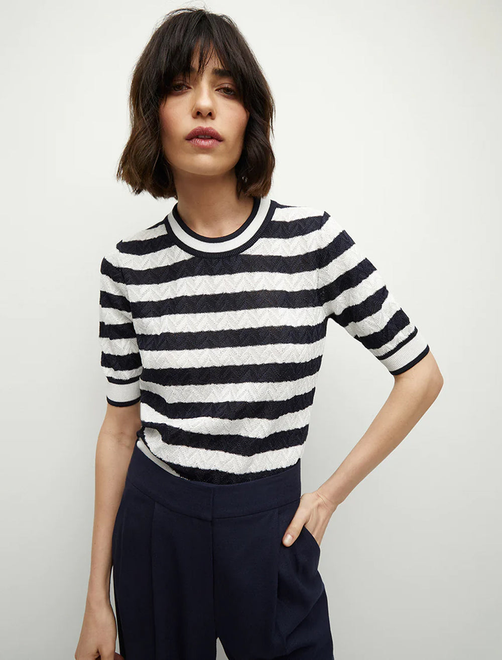 model wearing lisbeth knit top in white and navy stripe