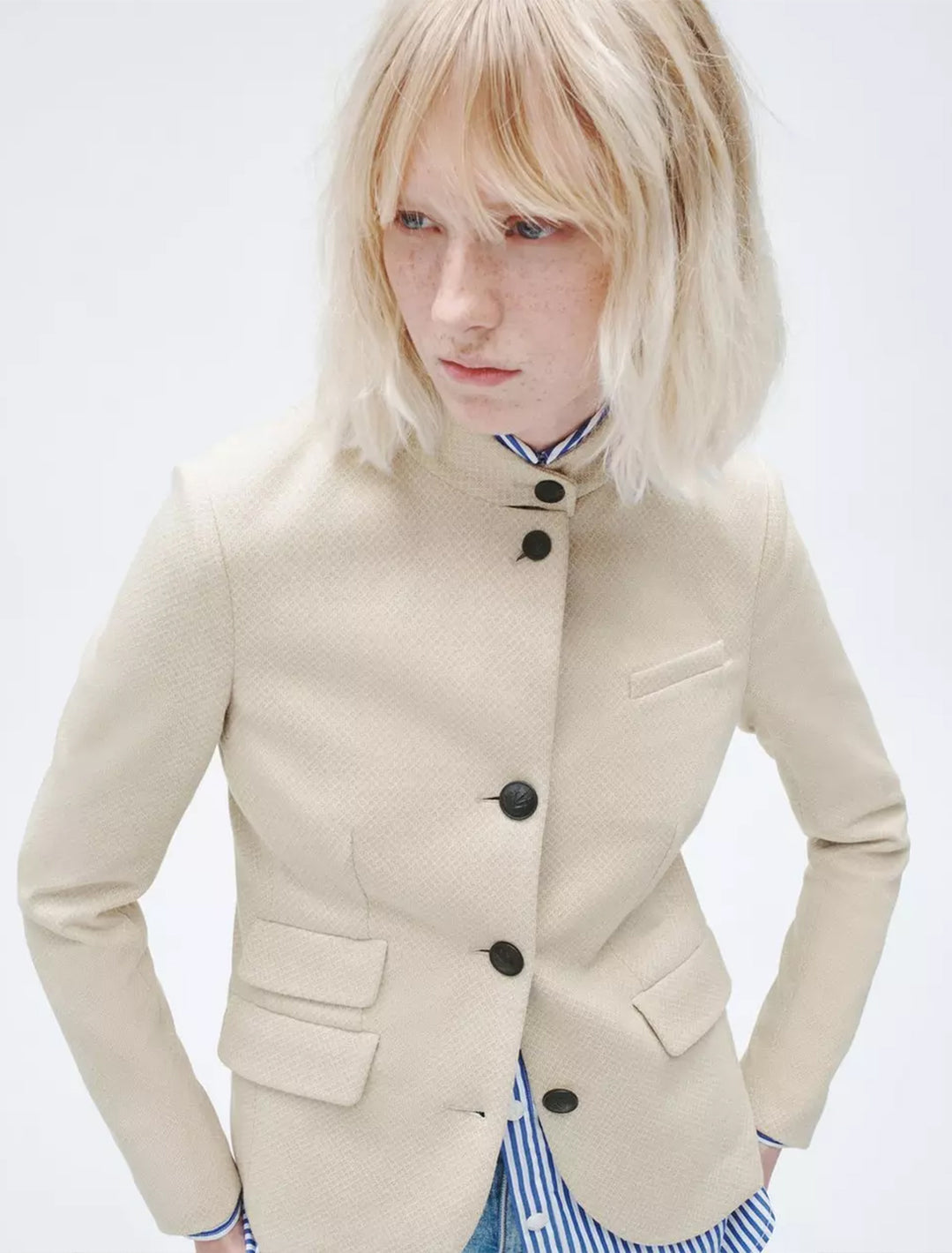 Model wearing Rag & Bone's slade italian plaid blazer in beige.