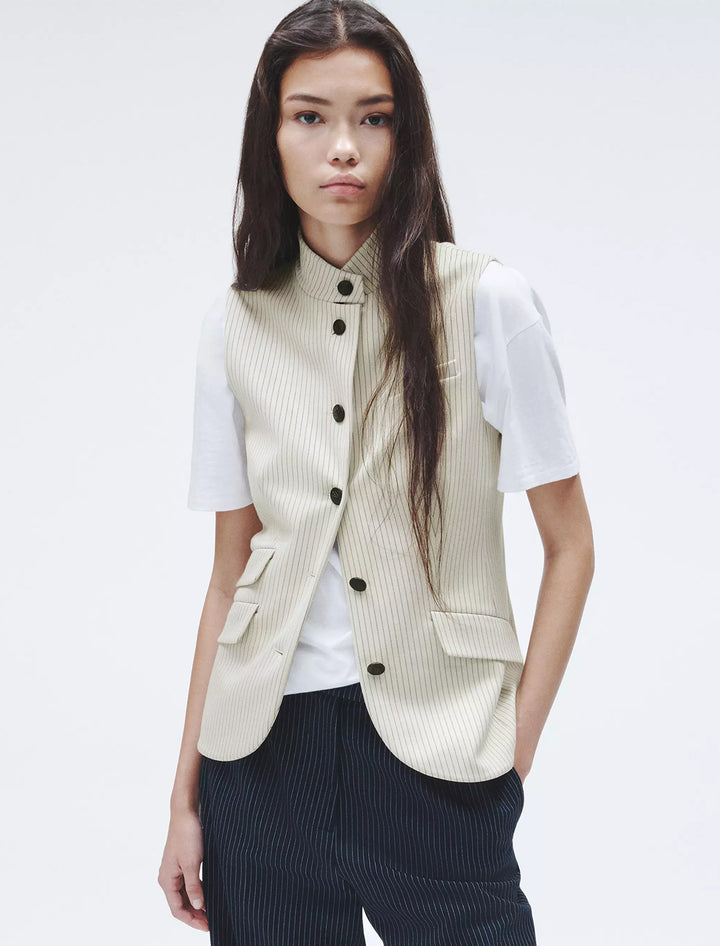 Model wearing Rag & Bone's ponte slade vest in ivory stripe.