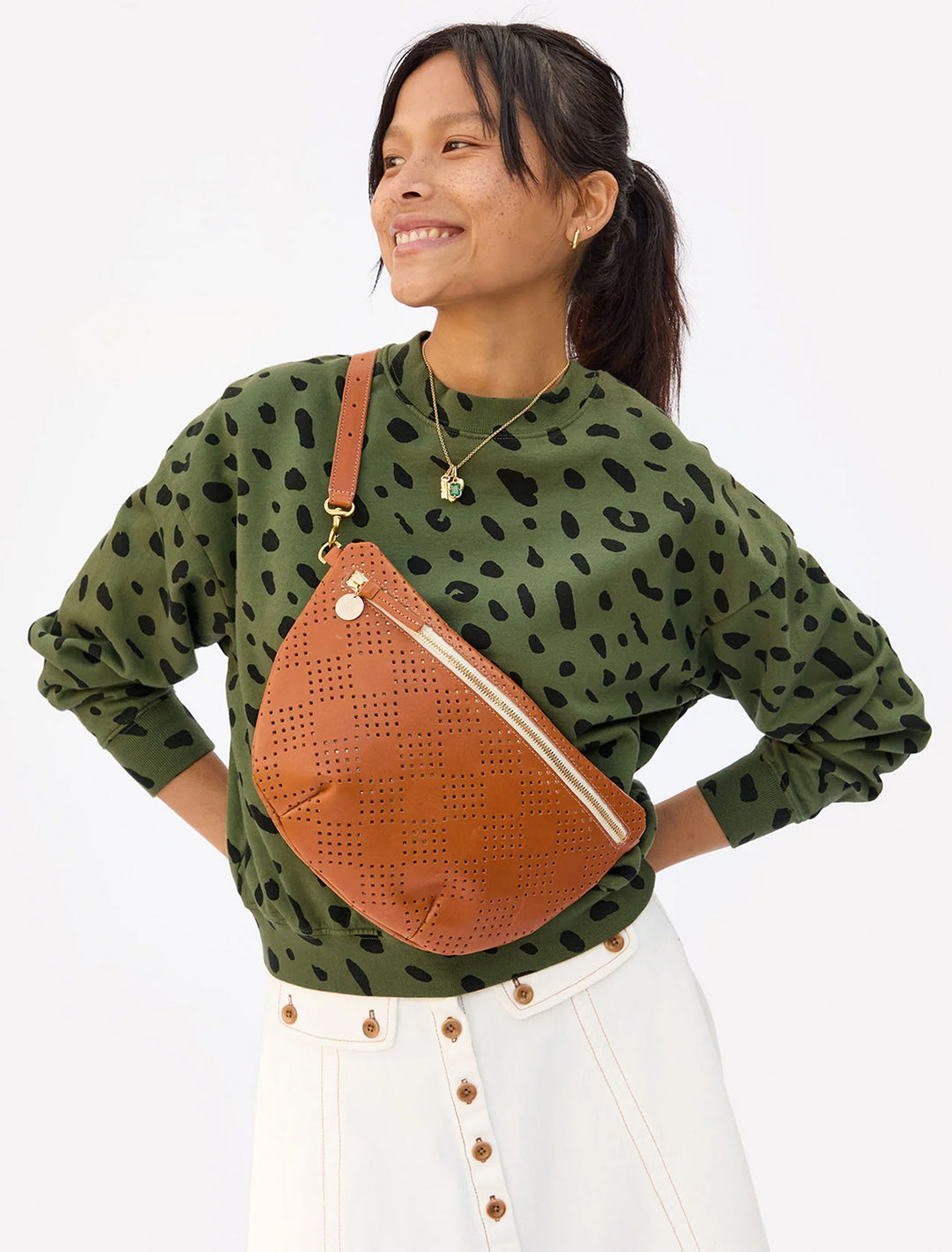 Model wearing Clare V.'s grande fanny in cuoio lightweight checker perf.